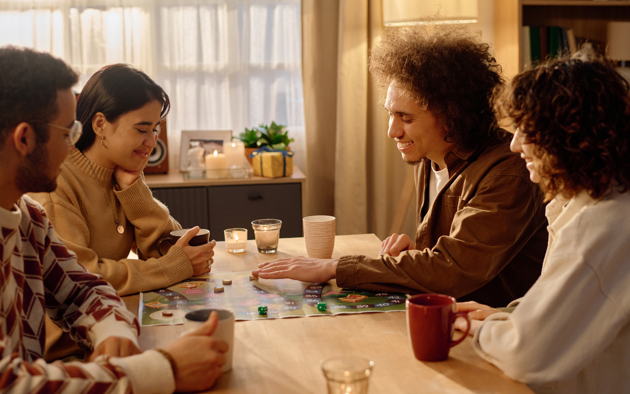 Friends playing board games together
